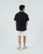 Load image into Gallery viewer, BUTTONLESS POLO in waffled black
