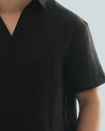 Load image into Gallery viewer, BUTTONLESS POLO in waffled black

