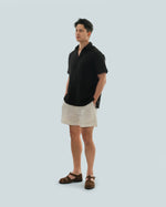 Load image into Gallery viewer, BUTTONLESS POLO in waffled black
