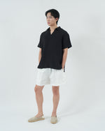 Load image into Gallery viewer, BUTTONLESS POLO in waffled black
