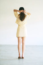 Load image into Gallery viewer, ASYMMETRICAL MINI SKIRT in butter
